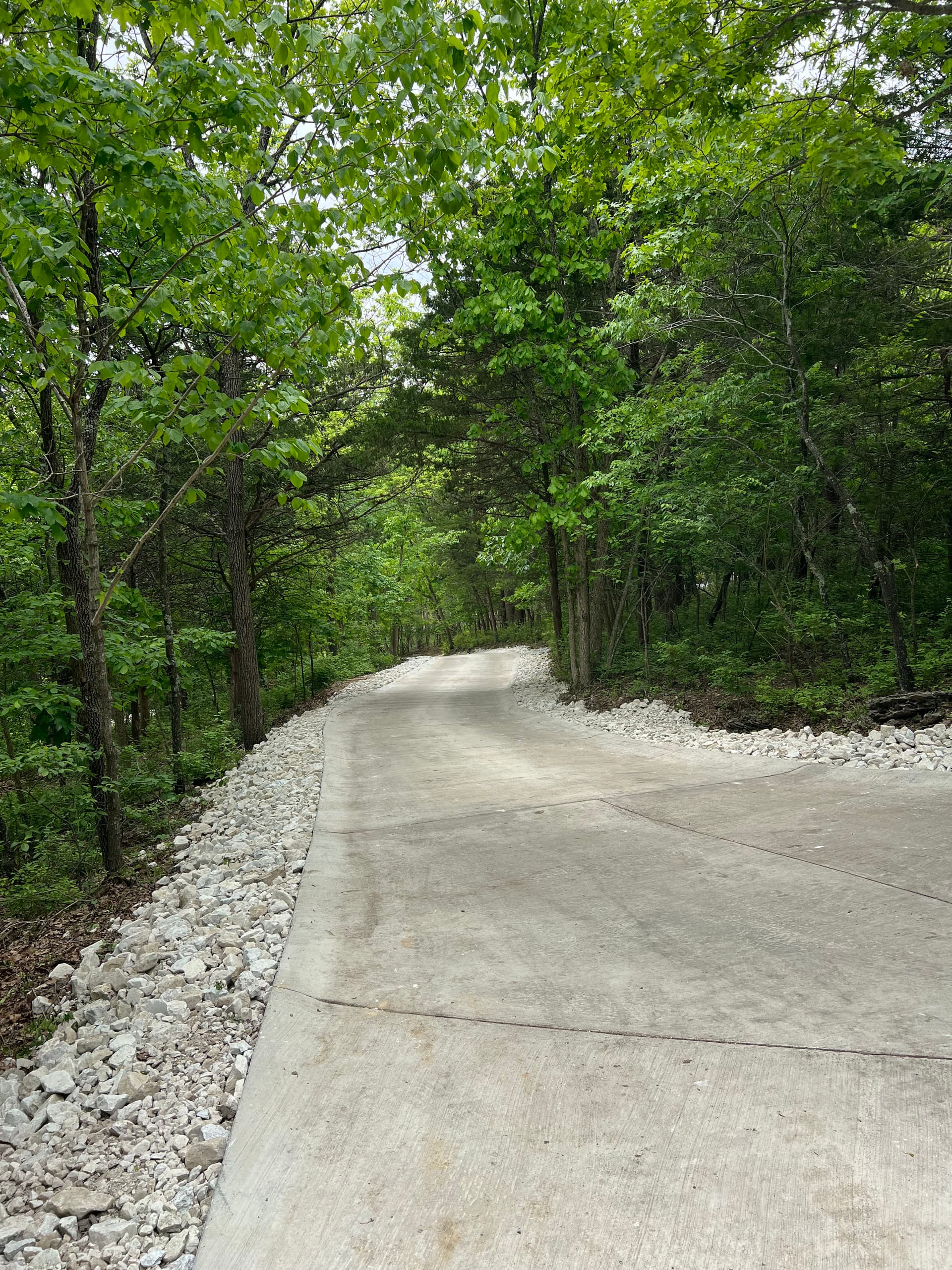 Steep Driveway Erosion Fixed With Regrading and Large Stone