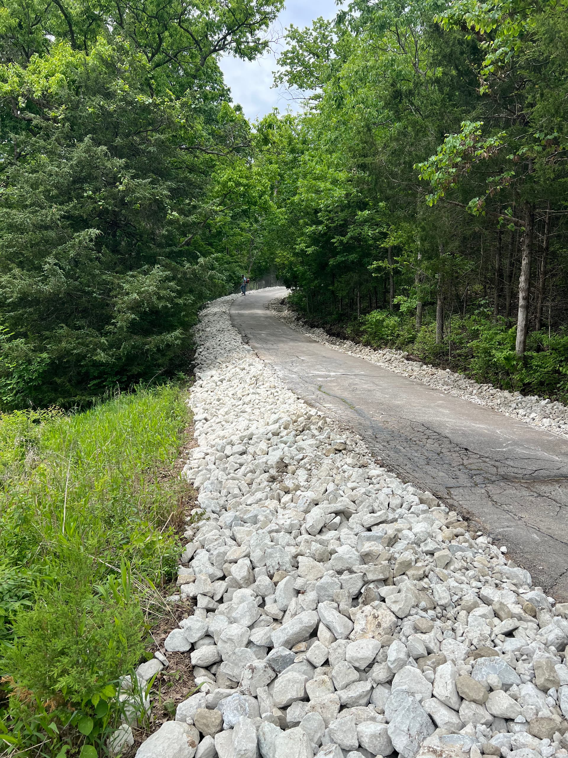 Steep Driveway Erosion Fixed With Regrading and Large Stone
